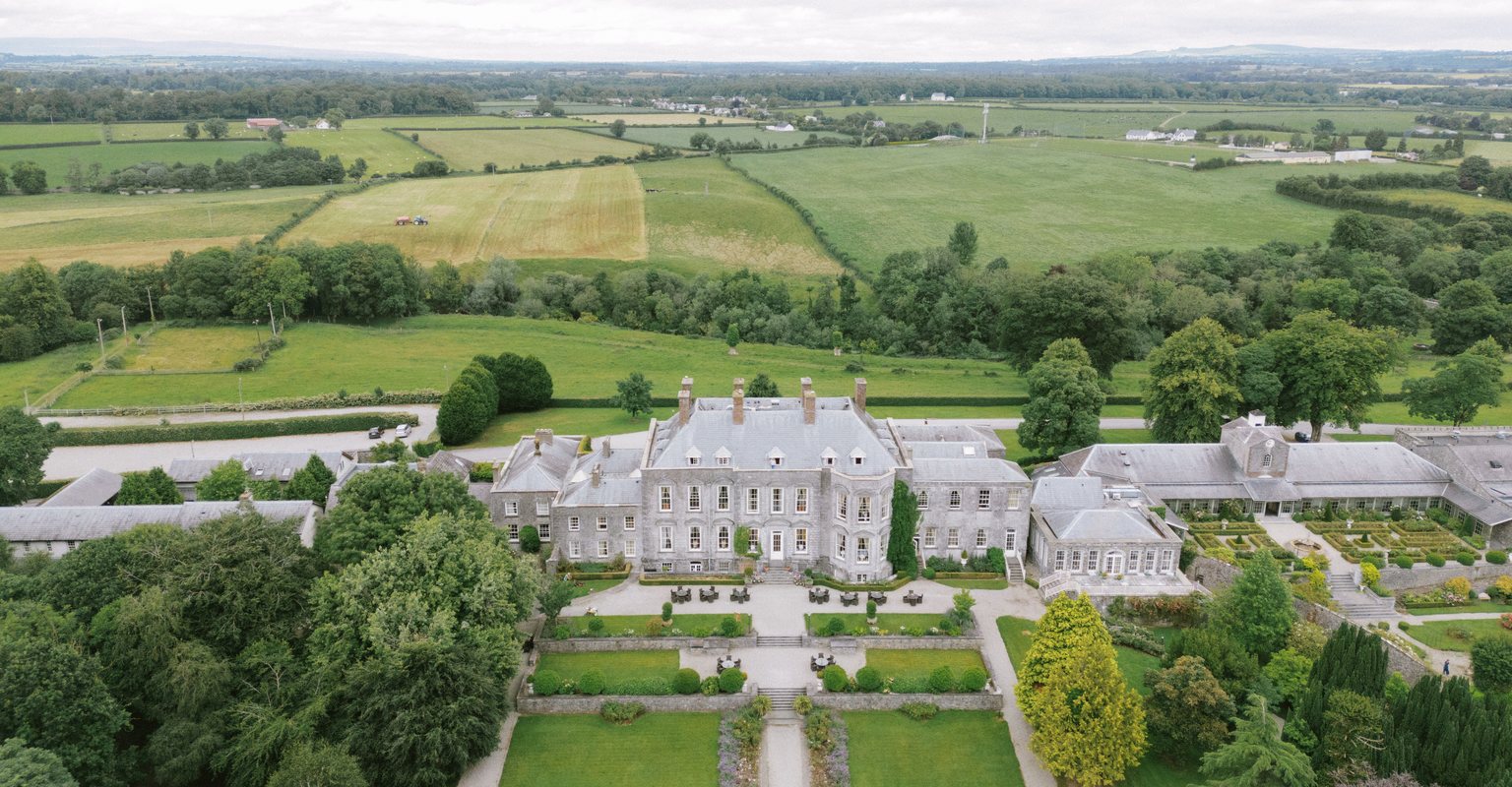 Aerial view of the castle, its formal gardens and the surrounding countryside