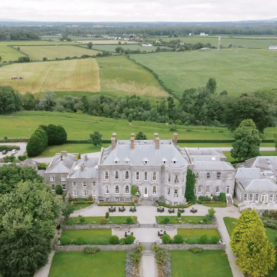 Aerial view of the castle, its formal gardens and the surrounding countryside